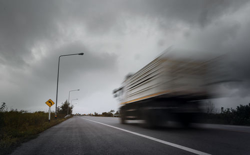 Blurred motion of highway against sky