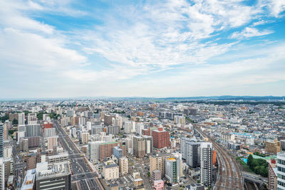 High angle view of city buildings against sky