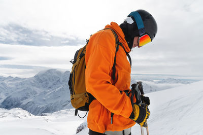 Side view of man wearing ski goggles