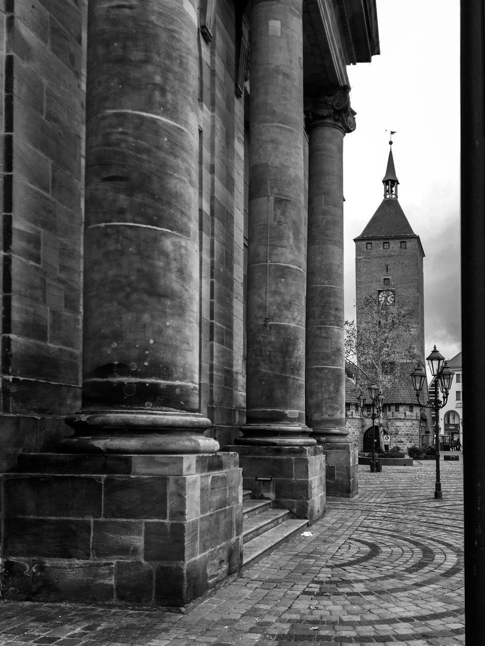 architecture, built structure, building exterior, building, belief, religion, place of worship, spirituality, architectural column, history, the past, travel destinations, city, no people, tourism, old, day, street, outdoors, colonnade