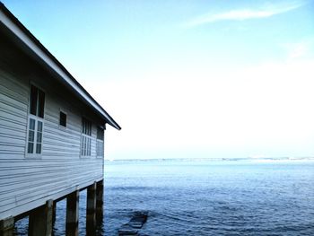 Scenic view of sea and building against sky