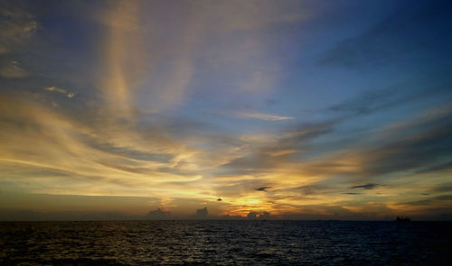 Scenic view of sea at sunset