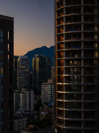 Skyscraper buildings in vancouver city at sunset