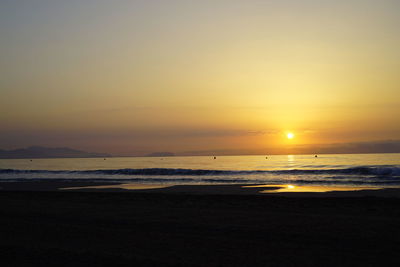 Scenic view of beach during sunset