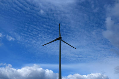 Low angle view of wind turbine against sky