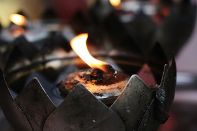 Close-up of burning tea light