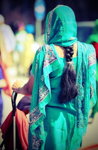 Rear view of woman standing outdoors