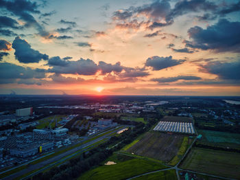 High angle view of buildings against sky during sunset