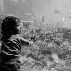 Boy with fish in water