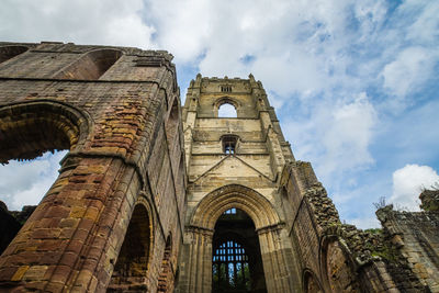 Low angle view of historic building against sky