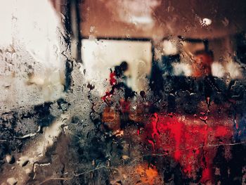 Full frame shot of wet glass window during rainy season