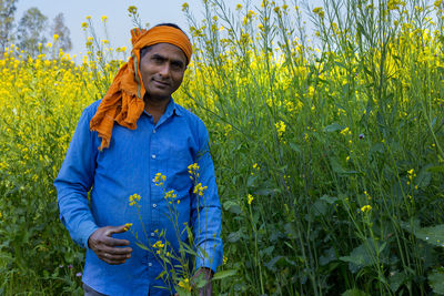 Young man standing in field