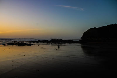 Scenic view of sea against sky at sunset