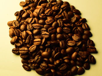 Close-up of coffee beans on table