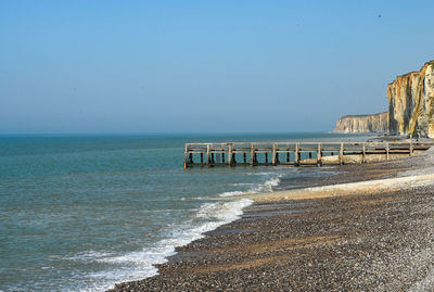 Scenic view of sea against clear blue sky