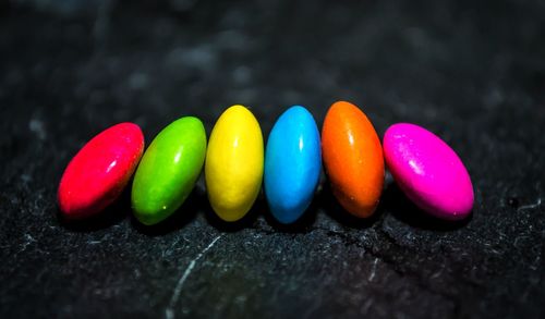 Close-up of multi colored candies on rock
