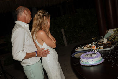 Rear view of couple standing outdoors