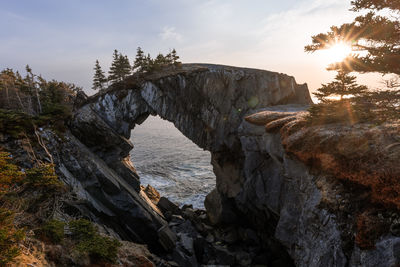 Berry head arch at sunrise, along the east coast trail of newfoundland, canada