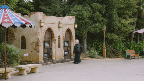 Rear view of woman walking on street