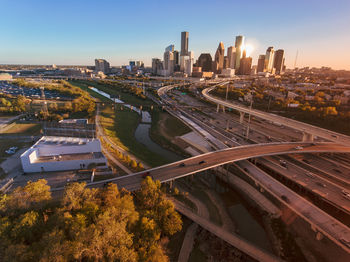 High angle view of city buildings against clear sky