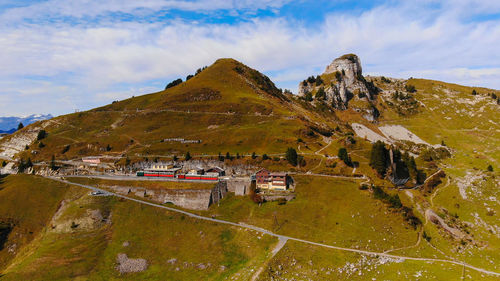 High angle view of buildings and mountains against sky