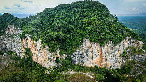 Panoramic view of waterfall against sky