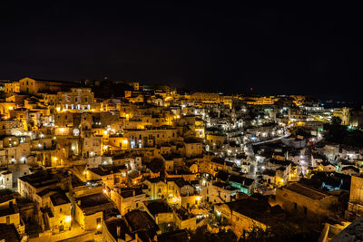 High angle view of illuminated buildings in city at night