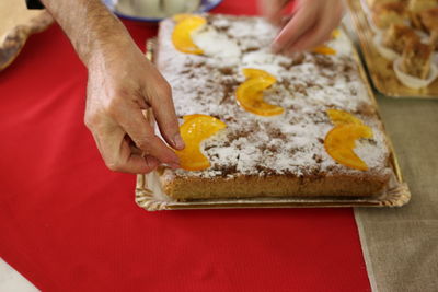 High angle view of person preparing food on table