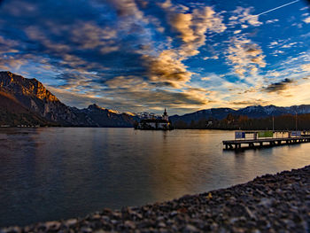 Scenic view of lake against sky during sunset