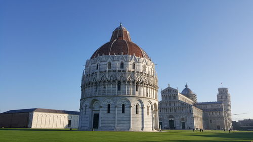 Low angle view of campo dei miracoli against clear sky on sunny day