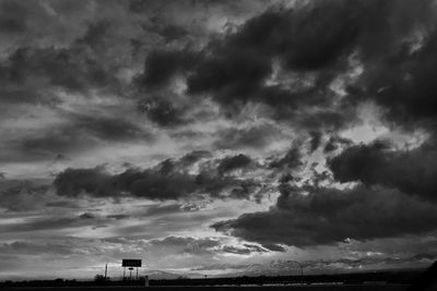 Low angle view of building against cloudy sky