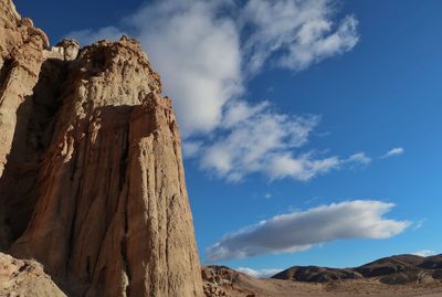 Landscape of orange and tan vertical rock formations in red rock canyon state park in california