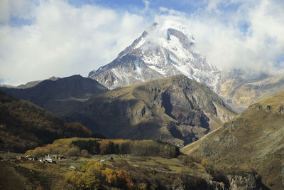 Scenic view of snowcapped mountains against sky