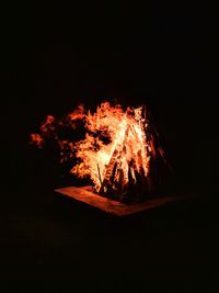 Bonfire against clear sky at night