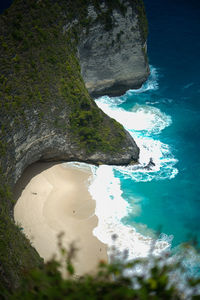 High angle view of rocks in sea