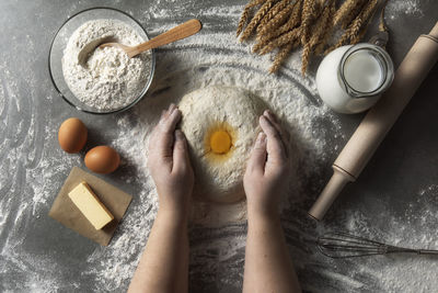 Rustic bread roll or french baguette, wheat and flour on black chalkboard. rural kitchen or bakery 