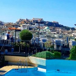 Buildings against clear blue sky