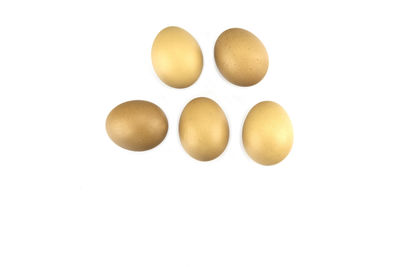 Directly above shot of eggs against white background