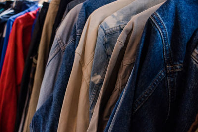 Close-up of clothes hanging in store
