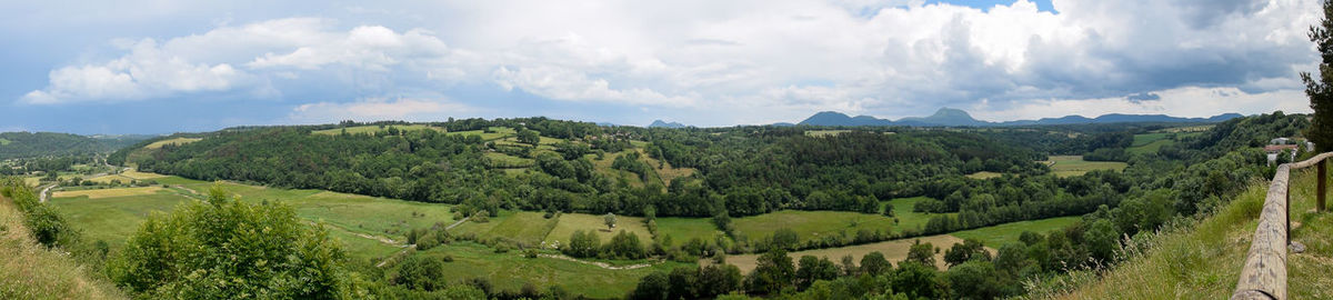 View of the chain of auvergne volcanoes under a thunderstorm