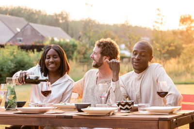 Friends sitting on table