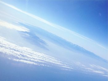 Scenic view of landscape against blue sky