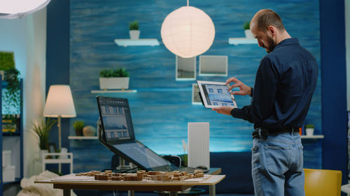 Side view of man working in restaurant