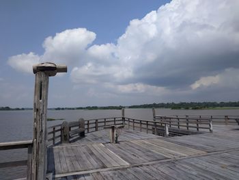 Pier on sea against sky