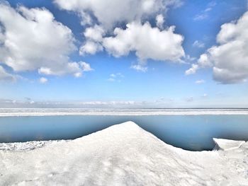 Scenic view of sea against sky during winter