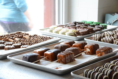 High angle view of food for sale in store - sweet chocolate candy