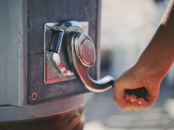 Close-up of man working in machine