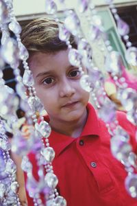 Portrait of cute girl with red flower