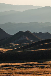Scenic view of mountains against sky during sunset