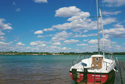 Sailboat on sea against sky